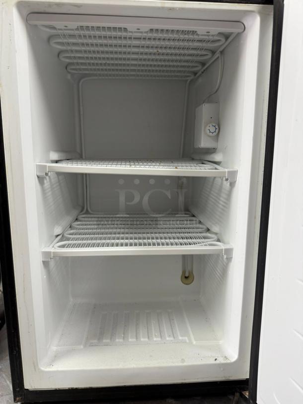 Euhomy MF-3.0-Y Compact Upright Mini Freezer in outstanding condition, featuring two wire shelves and a power dial.