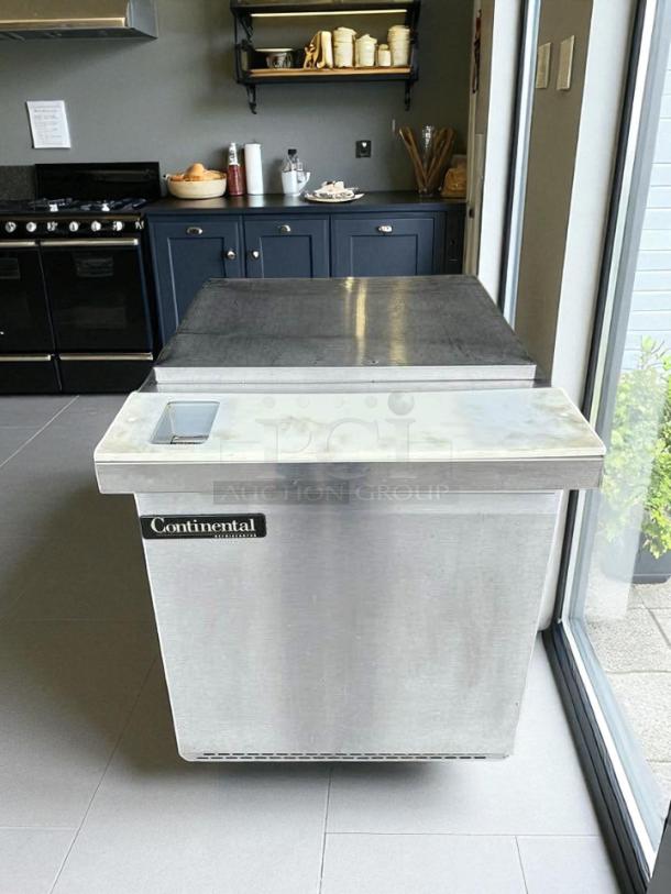 Continental Refrigerator SW27-12M, single door sandwich prep table in superb condition, stainless steel, with visible logo.