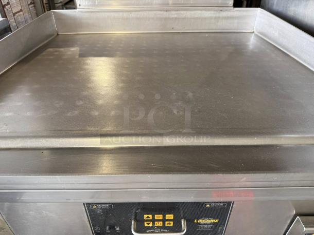 Alt text: AccuTemp GGF1201A3650 natural gas griddle in superb condition, stainless steel finish, control panel visible, fully tested.