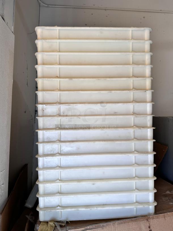 Set of 15 stackable dough trays made of food-grade plastic, standard 26" x 18" size, outstanding condition, fully cleaned.