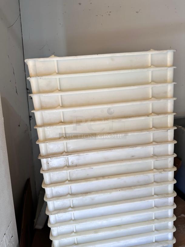 Set of 15 stackable dough trays, food-grade plastic, 26" x 18", in outstanding condition. Fully cleaned and ready for use.
