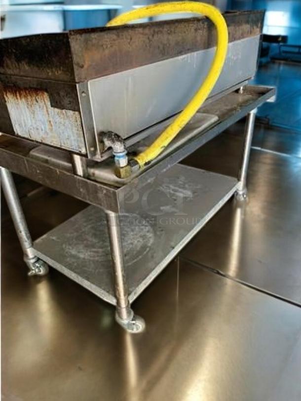 Atosa ATRC-36 36" Heavy-Duty Gas Charbroiler on metal stand; superb condition, tested, working. Yellow gas hose connected.