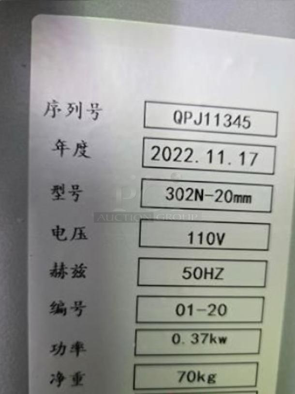 302N-20mm Bread Slicer label showing model, 110V power, 0.37kw, weight 70kg, made 2022. Fully tested.