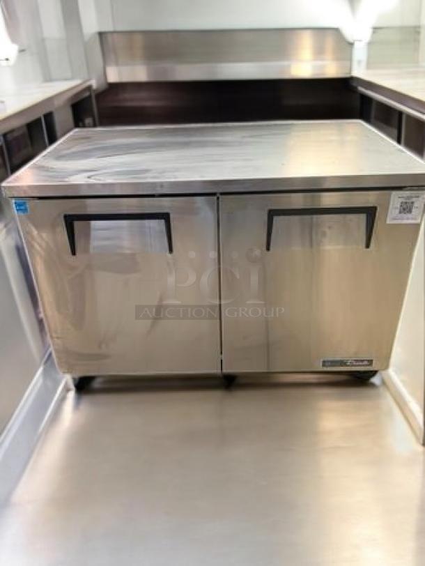 True TUC-48-HC undercounter refrigerator, stainless steel, immaculate condition, dual black handles, fully tested & working.