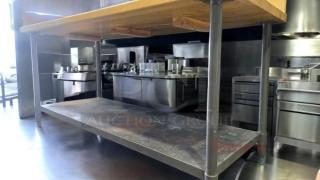 Custom heavy-duty butcher block table, 72"x30"x40", with stainless steel undershelf. Solid condition, suitable for immediate use.