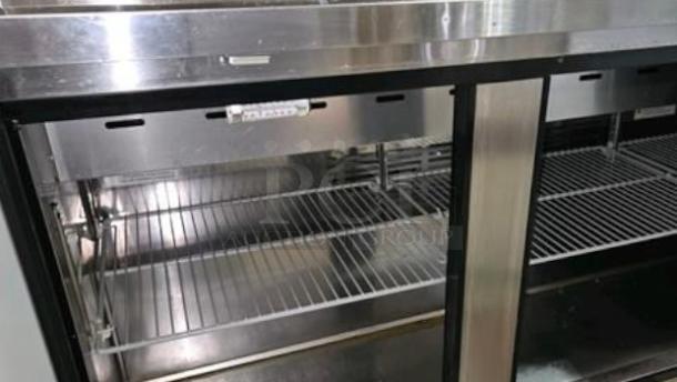 Turbo Air MST-72-N refrigerated prep table, stainless steel, excellent condition, interior shelves visible, 115V power.
