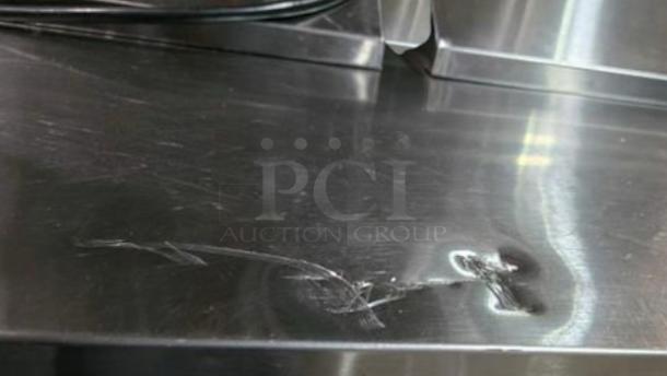 Turbo Air MST-72-N prep table with surface scratch and dent, stainless steel, fully tested, 115V, outstanding condition.