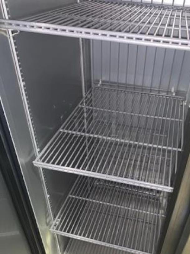 True T-35F-HC double solid door reach-in freezer, superb condition, fully tested. Adjustable shelves visible, 115V.