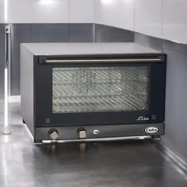 Brand new Cadco OV-013 half-size convection oven, stainless steel, 120V, unopened in box. Perfect countertop addition.
