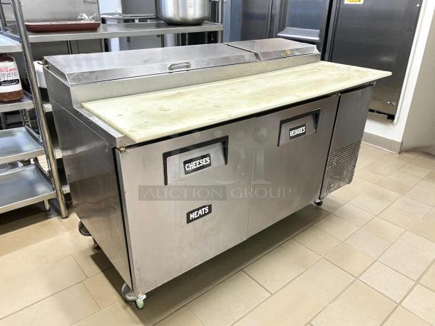True TPP-AT-67-HC refrigerated pizza prep table, 67 3/8", stainless steel, two doors labeled Cheeses, Meats, Veggies, tested, working.