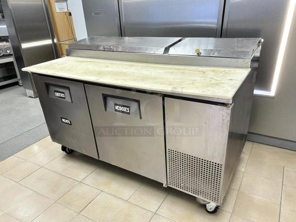 True TPP-AT-67-HC refrigerated pizza prep table, stainless steel, 67 3/8", two doors labeled Cheeses, Veggies, tested and working.