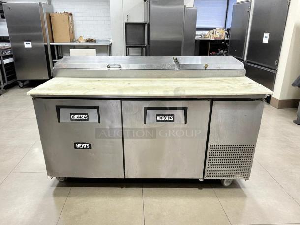 True TPP-AT-67-HC 67" refrigerated pizza prep table with two doors, labeled sections, stainless steel, tested, working condition.