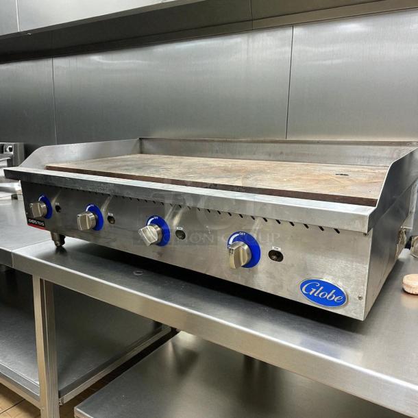 Globe GG48G 48" gas griddle in excellent condition, manual controls, 1" steel plate, tested, working, Globe logo visible.