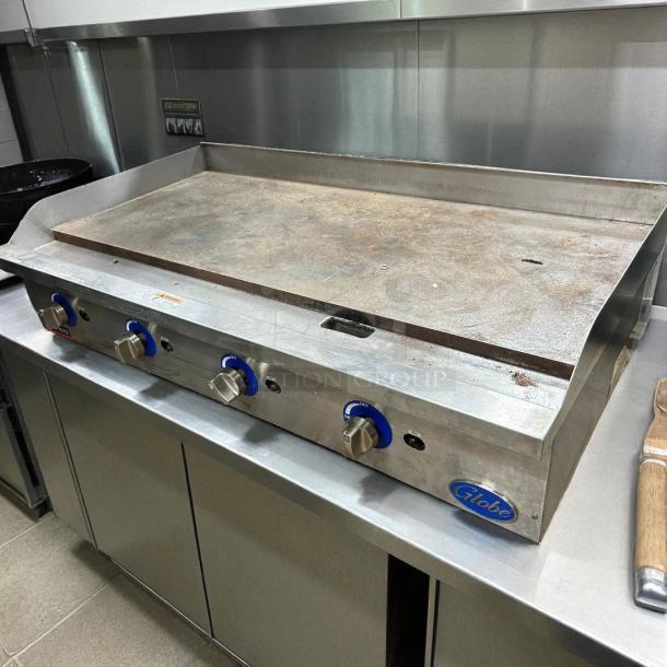 Globe GG48G 48" gas griddle, excellent condition, 1" steel plate, manual controls, convertible, tested and working.