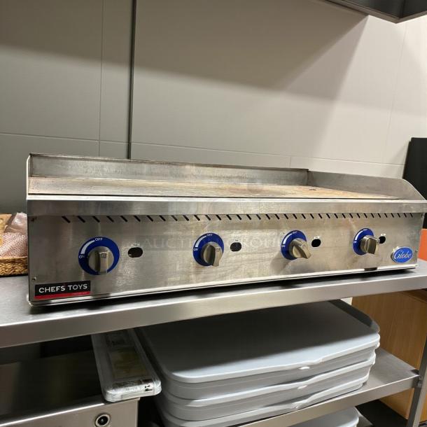 Globe GG48G 48" gas griddle, excellent condition, manual controls, 1" steel plate, on metal stand, tested working.
