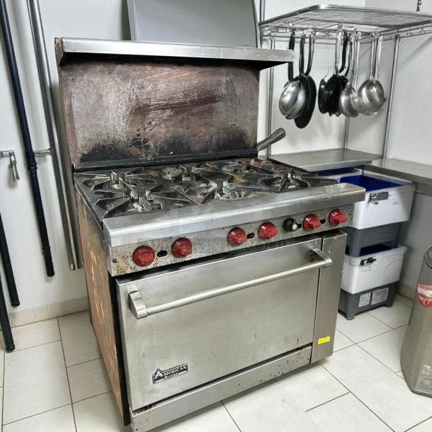 American Range AR-6 36" commercial gas range with 6 burners and standard oven, tested and working, visible wear on surface.