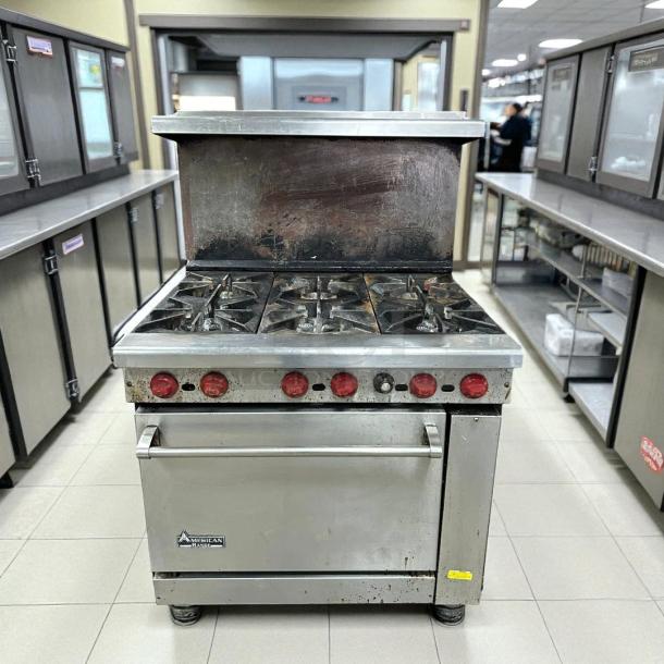 American Range AR-6 36" commercial gas range with 6 burners, standard oven, signs of use, tested and working.