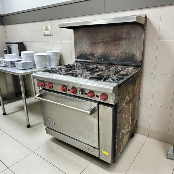 American Range AR-6, 36" commercial gas range, 6 burners, standard oven, tested and working, visible wear on surface.