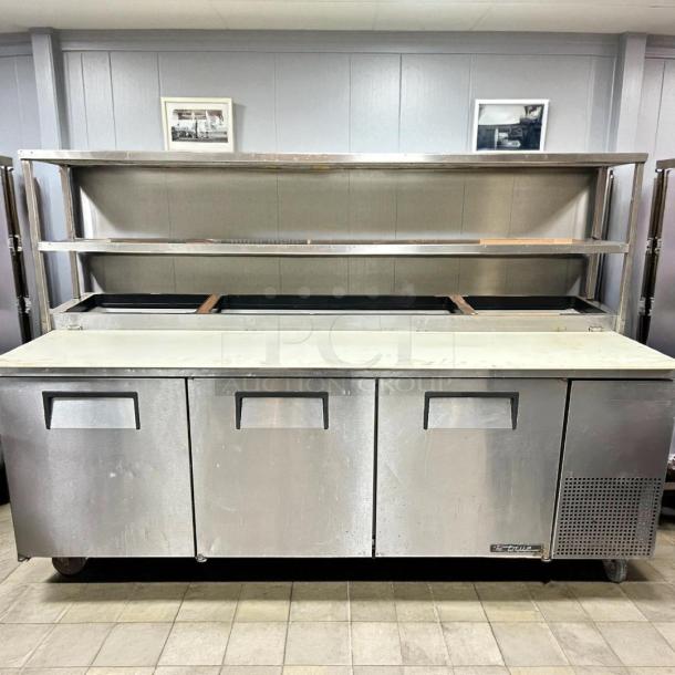 True TPP-93 93" 3-Door Refrigerated Pizza Prep Table, excellent condition, 12 pans capacity, 115v, tested and working.
