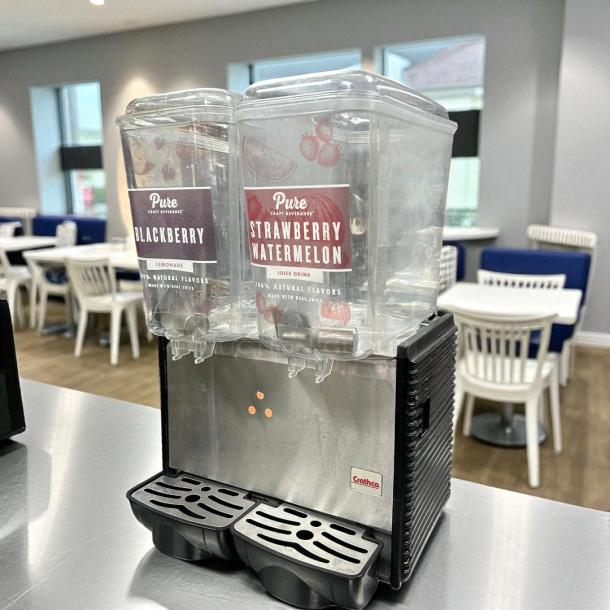 Crathco D25-4 drink dispenser, great condition, with two 5-gallon bowls, labels for blackberry lemonade and strawberry watermelon, 115v, tested and working.