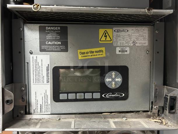 CORNELIUS VIPER 2 ICEE machine control panel with caution labels and maintenance reminders. Model details visible.