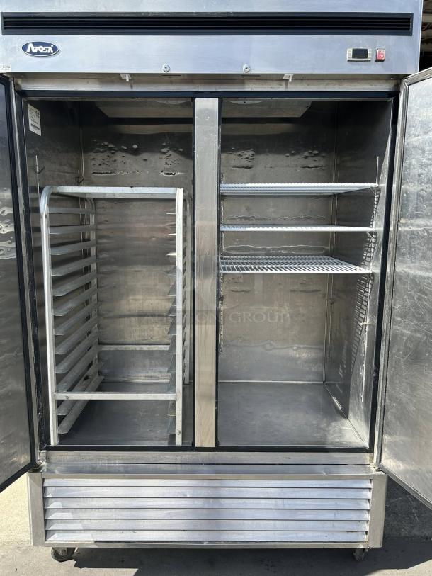 Atosa MBF8507GR 46 Cu.ft double door reach-in refrigerator, excellent condition, shelves and trays visible, tested and working.