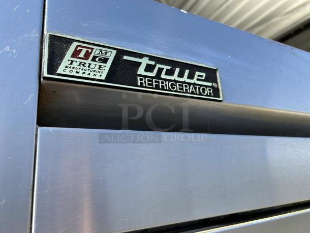 True T-49-HC refrigerator with solid swing door, tested and working. Visible True Manufacturing label, stainless steel surface.