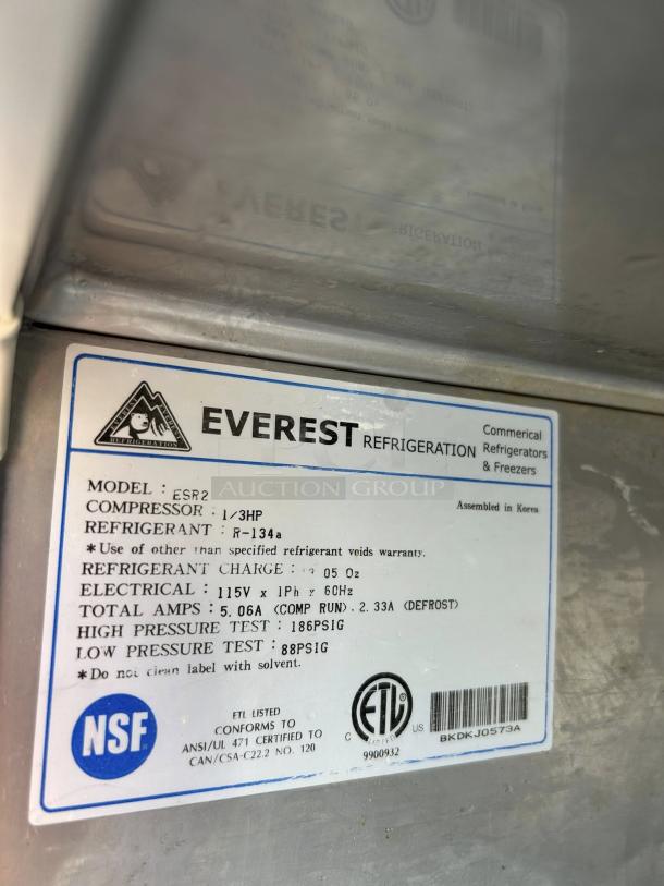 Everest Refrigeration ESR2 label indicating model, specs, and certifications. Features R-134a refrigerant, 115v, tested.