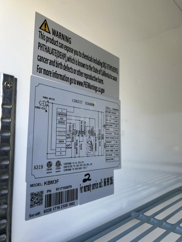 Kintera KBM3F three-section bottom mount freezer label showing model, serial number, and safety warning.