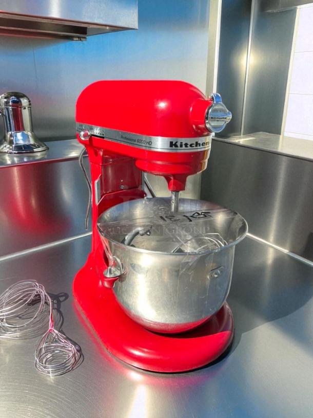 Red KitchenAid Professional 6000 HD Stand Mixer, 6 Quart, model KSM6573CCU. Tested, working condition, with attachments.