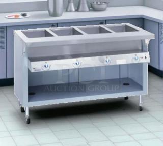 Duke E304 hot food table, 58 3/8", 4 wells, cutting board, 240v/1ph. Tested and working. Ideal for commercial kitchens.