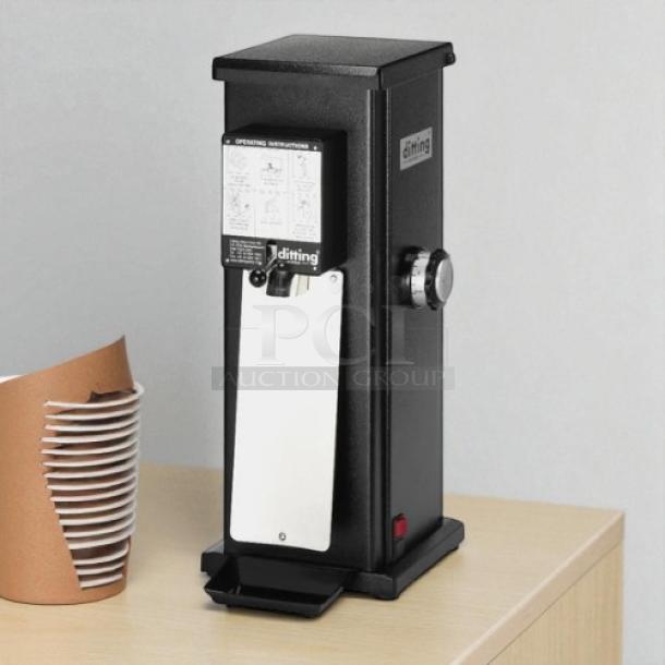 Ditting KR1203 commercial espresso grinder in like-new condition, black finish, operating instructions label visible.