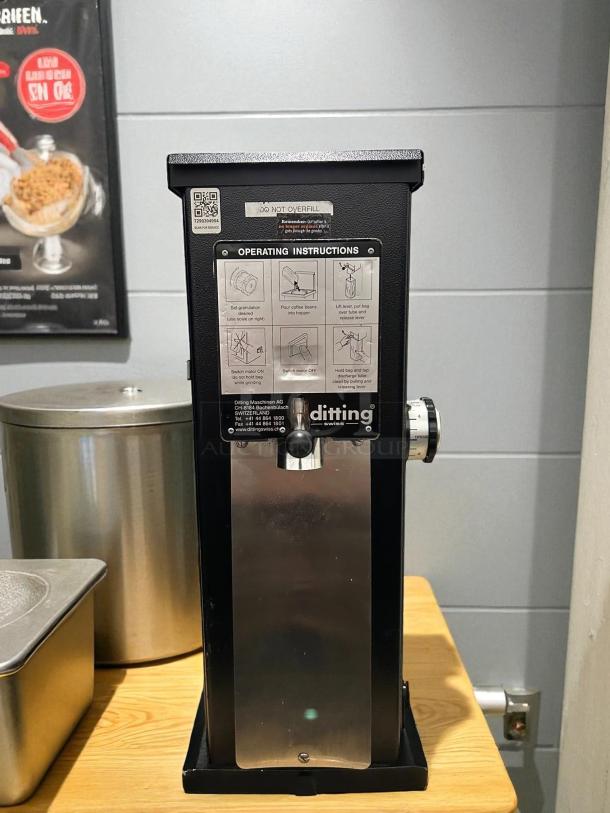 Ditting KR1203 commercial espresso coffee grinder in like-new condition, featuring operating instructions and brand markings.