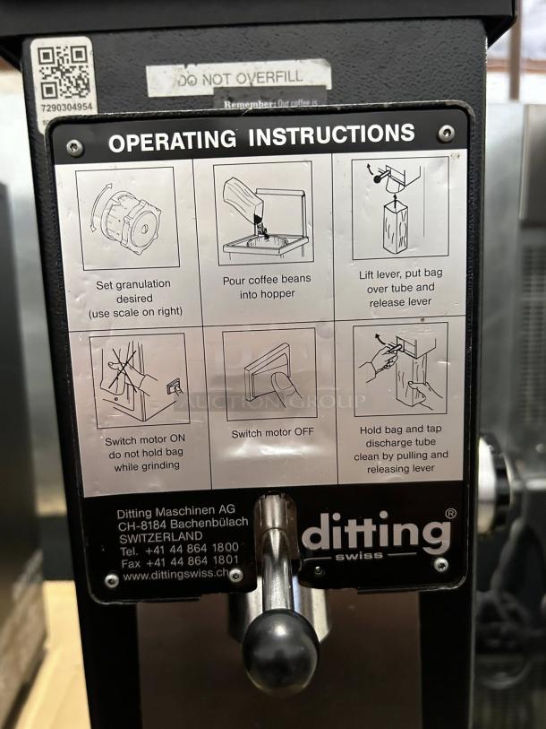 Ditting KR1203 commercial espresso coffee grinder, like new condition, includes clear operating instructions on panel.