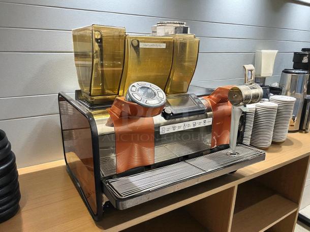 Thermoplan Mastrena II espresso machine, used condition, featuring control panel and dual coffee bean hoppers.