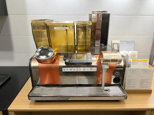 Thermoplan Mastrena II espresso machine, stainless steel, excellent condition, with digital controls and visible markings.