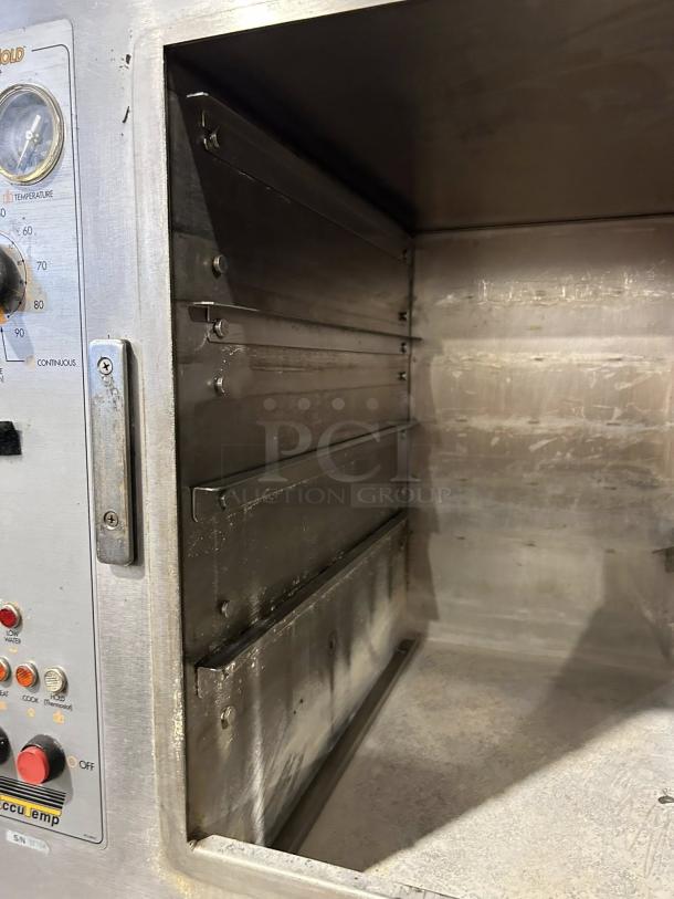 AccuTemp S62083D100 6-pan electric steamer, excellent condition, visible controls, stainless interior, 208V, tested working.