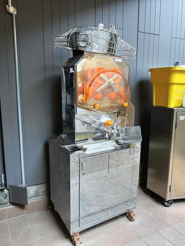 Citrocasa 8000 SB-ATS Advance Citrus Juicer, commercial-grade, "as is" condition with visible wear, stainless steel body.