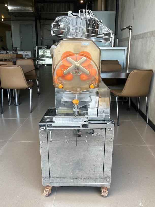 Citrocasa 8000 SB-ATS Advance Citrus Juicer, "As Is" condition, visible signs of use, stainless steel, automatic operation.