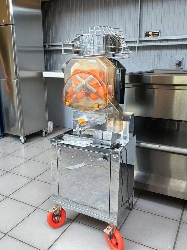 Citrocasa 8000 SB-ATS Advance Citrus Juicer, "As Is" condition, chrome finish, orange pressing mechanism, visible wear.