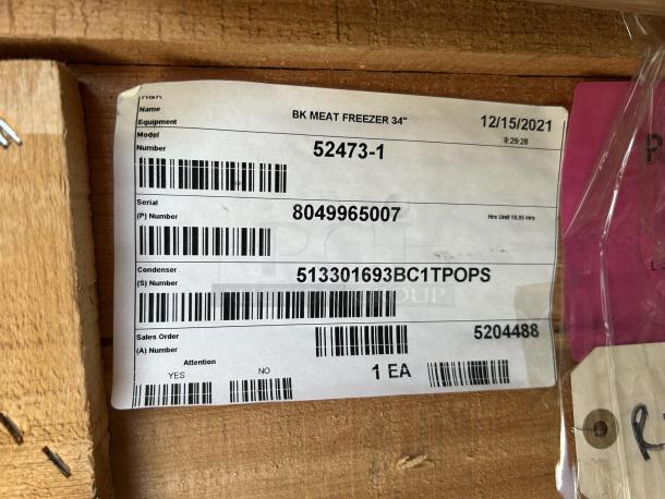 BKI 52473-1 stainless steel commercial meat freezer, brand new, on casters, 115V, 1 phase, in original packaging. Visible label with serial number.