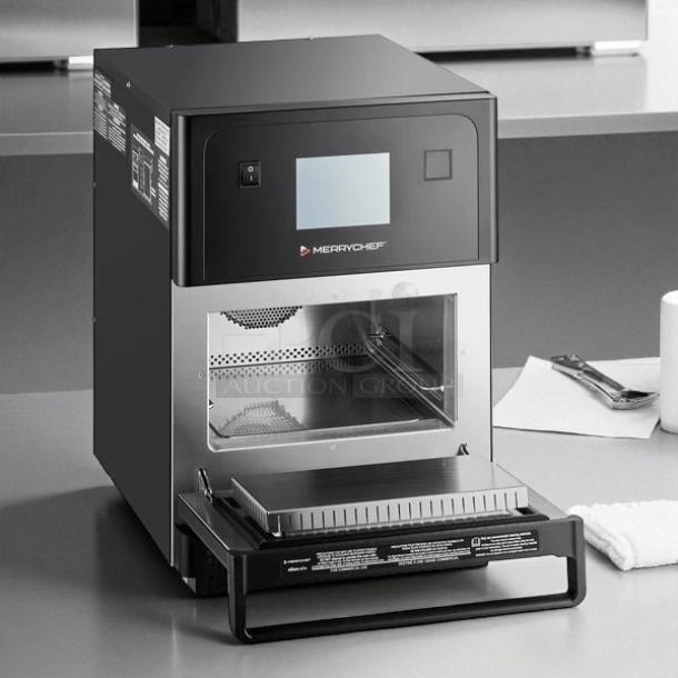 Brand new Merrychef eikon e4s high-speed countertop oven in original packaging, featuring digital display and stainless steel interior.