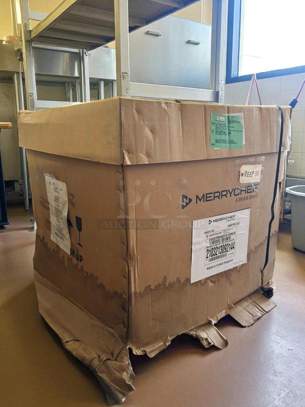 Brand new Merrychef eikon e4s high-speed cooking oven in original packaging. Box shows wear, labels with model and origin details.