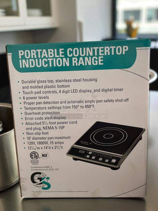 Global Solutions GS1681 countertop induction range in packaging. Features glass top, stainless steel housing, 120v, 6 power levels.