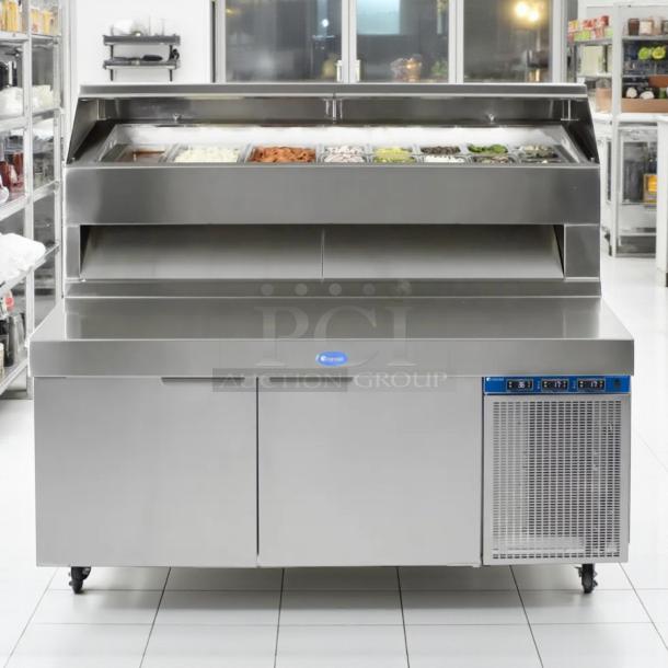 Stainless steel refrigerated prep table with cooling unit, dual doors, and ingredient containers, excellent condition.