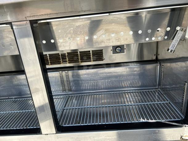 Everest EPBWR2 59" two-section mega top prep table, excellent condition, two doors, includes 24 pans, tested and working.