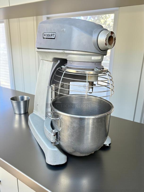 Hobart Legacy+ HL200 20 Qt. planetary mixer with guard, standard accessories; silver, tested, working condition.