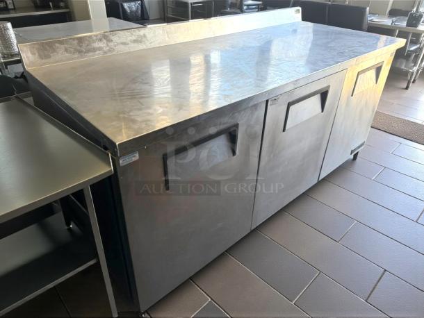 True TWT-72-HC 72" worktop refrigerator in excellent condition. Features three sections and stainless steel finish. 115v power.