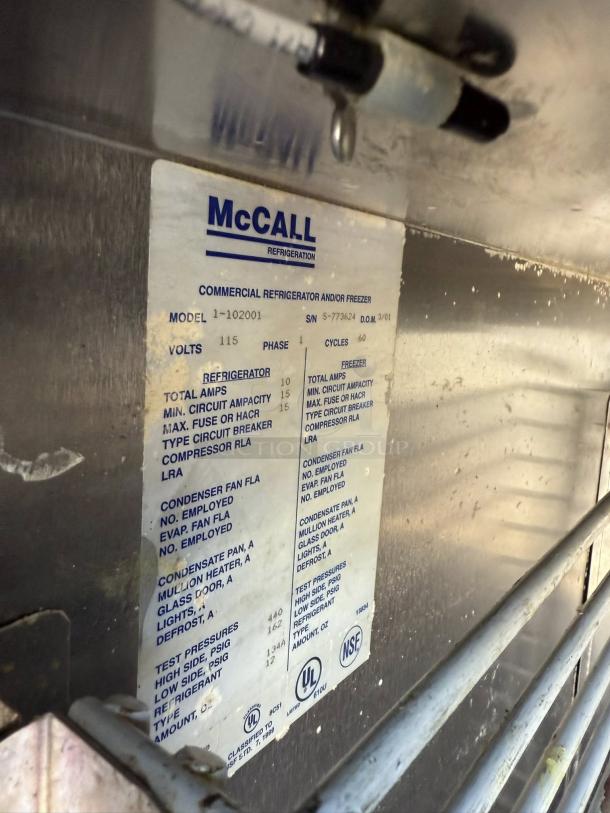 McCall Model 1-102001 single door reach-in refrigerator in great condition, showing specification label with testing details.