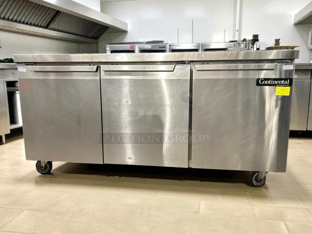 Continental Refrigerator SW72-N-BS, 72" stainless steel worktop refrigerator with backsplash, on wheels, in good condition.